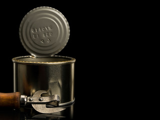 Open can and old can opener