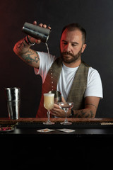 Professional barista prepares cocktails