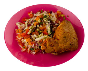 chicken wing with vegetable salad on a plate. chicken wing with vegetable salad isolated on white...
