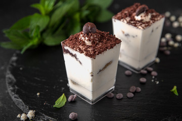 Mini dessert made from delicate creamy vanilla mousse and chocolate. Candy bar. Assortment of confectionery.