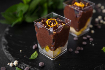 Mini dessert made of chocolate, cream and citrus. Candy bar. Assortment of confectionery.