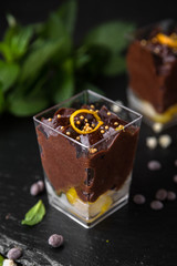 Mini dessert made of chocolate, cream and citrus. Candy bar. Assortment of confectionery.