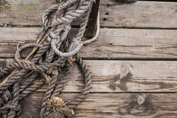 Fototapeta na wymiar Boat Rope Textured close up. Top view of old vintage ropes on wooden background.