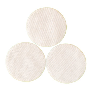 Three white wadded disks for removal of a make-up. Isolate on white background.