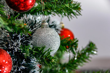 Christmas balls in various of colors and other holiday ornaments. Winter holiday decoration for Christmas and new year.