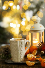 Mug with hot tea, Christmas background
