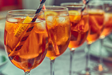 Full glasses ready for party and fun. Cocktail with ice and straw.