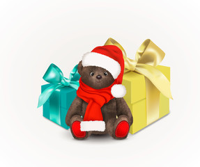 Sitting fluffy cute brown teddy bear with christmas santa claus hat and red long scarf. Children's toy isolated on white background with two gift boxes with bows or ribbons. - 237643730