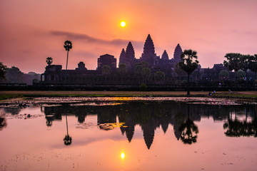 Fototapeta na wymiar Amazing view of Angkor Wat temple at sunrise. The temple complex Angkor Wat in Cambodia is the largest religious monument in the world. Location: Siem Reap, Cambodia. Artistic picture. Beauty world