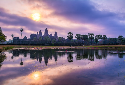 Amazing view of Angkor Wat temple at sunrise. The temple complex Angkor Wat in Cambodia is the largest religious monument in the world. Location: Siem Reap, Cambodia. Artistic picture. Beauty world