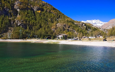 Lake of Ceresole Reale, near the Nivolet pass, clear autumn morning, blue sky, Piedmont, Italy