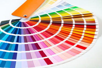 Color palette, guide of paint samples, close-up of colored catalog on a white background