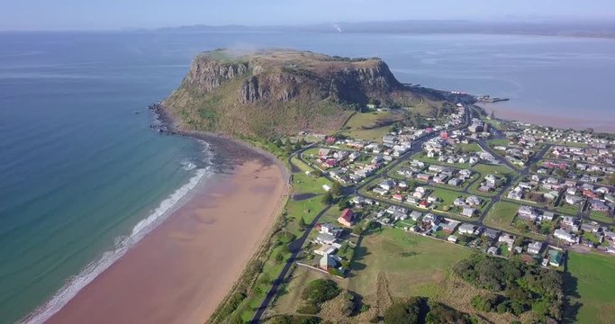 Amazing aerial flight over Stanley along a huge rock in Tasmania, Australia