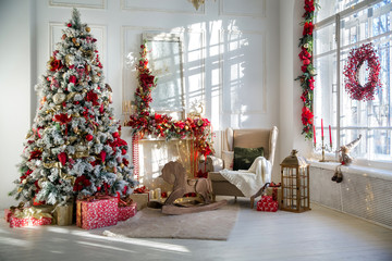 White room interior in red tones with New Year tree decorated, present boxes and artificial fireplace - Powered by Adobe