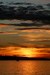 Beautiful sunset with various clouds over the sea. 