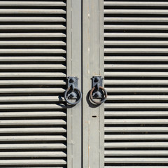 Closed metal shutters blinds and window handle