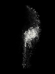 Splash cloud of wheat flour on black background