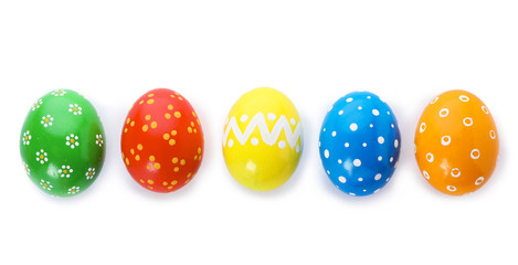 Decorated Easter eggs on white background, top view. Festive tradition