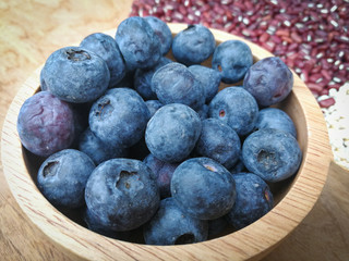 fresh blueberries / ripe blueberries in wooden bowl - blueberry fruit for healthy