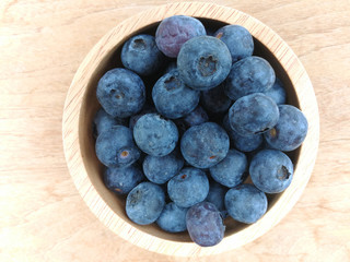 fresh blueberries / ripe blueberries in wooden bowl - blueberry fruit for healthy