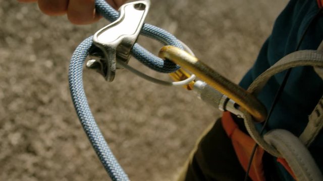 Climber with safety harness belaying Mt Habrich Canada