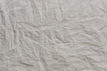 Texture of the crumpled linen fabric. Blank fabric background.