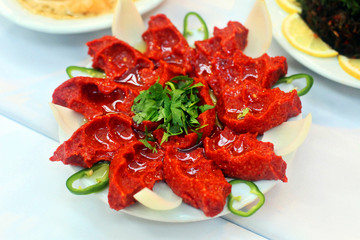 Traditional Turkish food 'Raw Meat' (Cig Kofte) in the restaurant table in Antakya, Turkey.