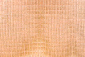 Fototapeta premium Сolored towel texture. Light brown fabric background.