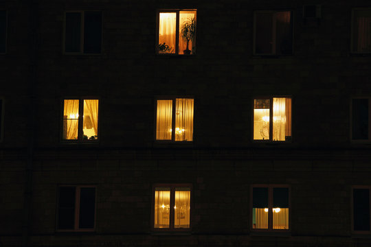 lighted night windows of houses