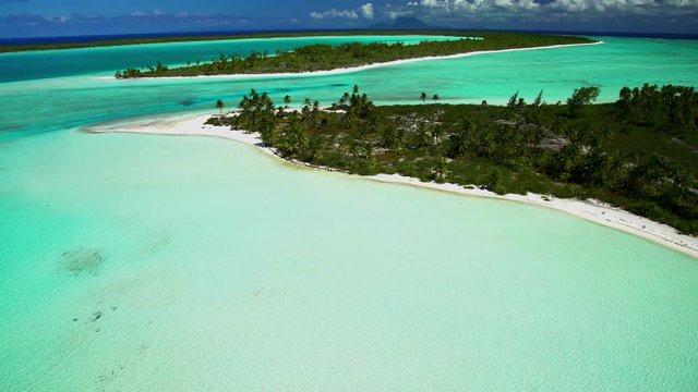 Aerial view Tupai Heart Island a coconut plantation Island in the South Pacific 