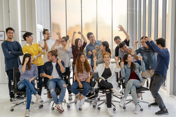 Portrait Group Of Asian and Multiethnic Business people with casual suit in happy action when...