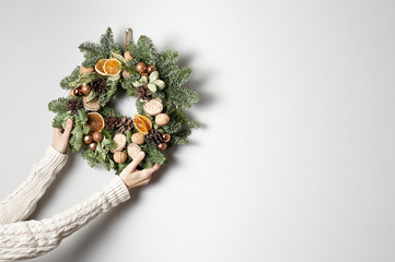 Rustic Christmas wreath on a gray background