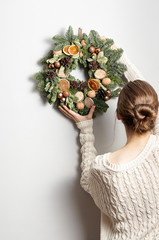 Rustic Christmas wreath on a gray background