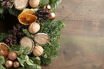 Fototapeta na wymiar Christmas wreath on a vintage wooden background