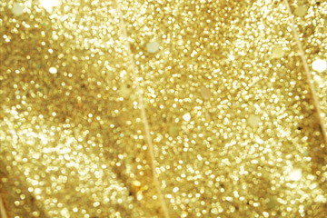 abstract defocused shiny sparkle gold glitter bokeh background