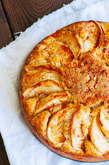 Homemade apple tea cake on a wooden board.