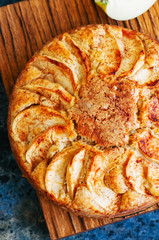 Homemade apple tea cake on a wooden board.