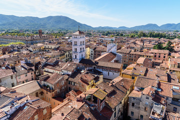Fototapeta na wymiar View on city from Torre delle Ore clock tower in Lucca. Italy