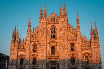 Sunset light on the Duomo in Milan, Italy. © jonbilous