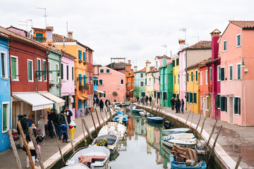 Colorful buildings along a canal in Burano, Venice, Italy