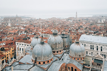 Fototapeta na wymiar View of Saint Mark's Basilica from the Campanile in Venice, Italy
