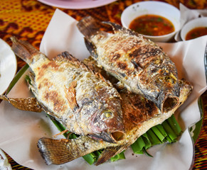 Grilled fish tilapia with Salt in asian style fish burned herb