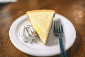 Key lime pie slice at Florida restaurant in the Keys. World famous american traditional dessert homemade, with whipped cream topping on the side. Local food, USA travel.