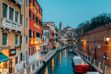 Fototapeta na wymiar A canal at night, in Venice, Italy