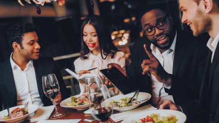 Businessmans Having Meeting In Indoor Restaurant