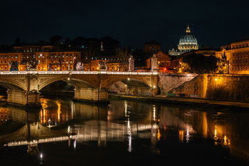 Ponte Vittorio Emanuele II and St. Peter's Basilica at night, in Rome, Italy