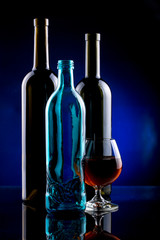 Still Life with glass bottles and glass
