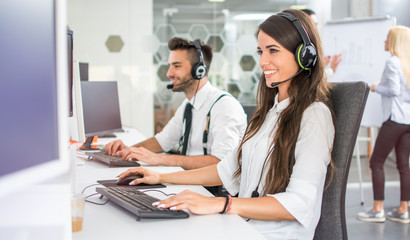 Friendly positive female business consultant, call center operator in call centre office
