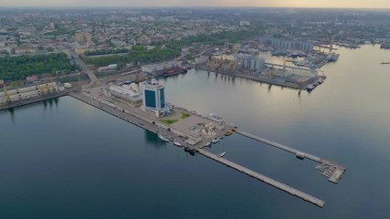 Aerial of Odessa port with straight piers, yachts and Potemkin Stairs in summer