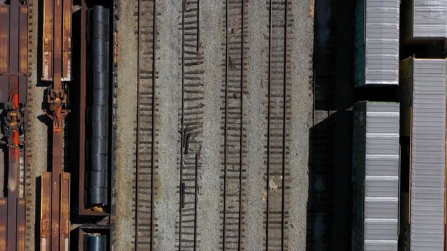 Flying above multiple rows of train tracks.
